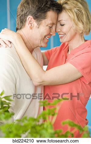 Stock Image - Caucasian couple hugging. Fotosearch