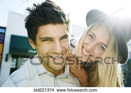 Caucasian couple smiling outdoors View Large Photo Image Picture - Caucasian couple smiling outdoors. Fotosearch