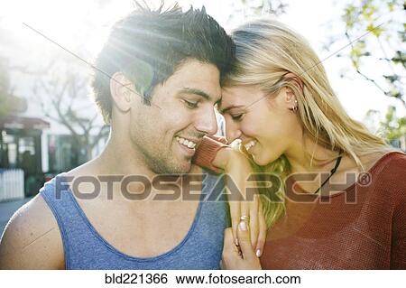 Stock Photograph - Caucasian couple smiling outdoors. Fotosearch