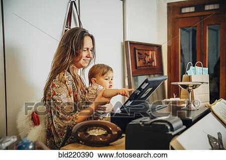 Caucasian entrepreneur and son playing with register View Large Photo Image Stock Image - Caucasian entrepreneur and son playing with register. Fotosearch
