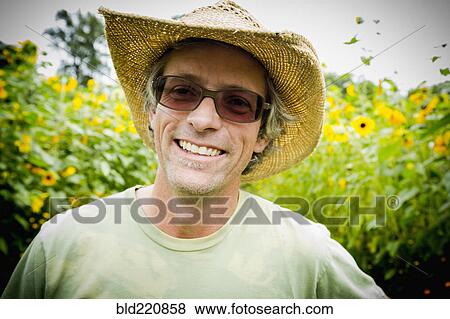 Caucasian farmer smiling outdoors View Large Photo Image Stock Photo - Caucasian farmer smiling outdoors. Fotosearch