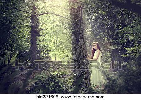 Stock Photograph - Caucasian girl exploring forest. Fotosearch
