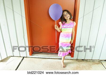 Caucasian girl holding balloon View Large Photo Image Picture - Caucasian girl holding balloon. Fotosearch