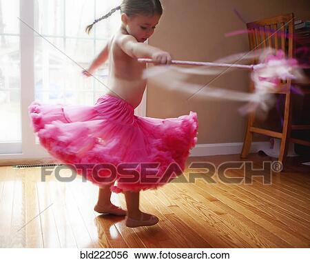 Caucasian girl twirling in skirt View Large Photo Image Stock Photograph - Caucasian girl twirling in skirt. Fotosearch