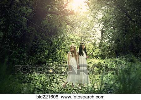 Stock Photography - Caucasian girls exploring garden. Fotosearch