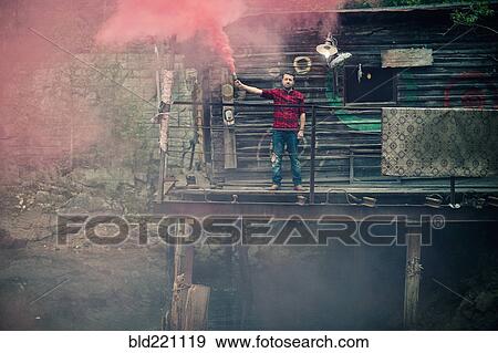 Caucasian man spraying pigment powder View Large Photo Image Stock Photo - Caucasian man spraying pigment powder. Fotosearch