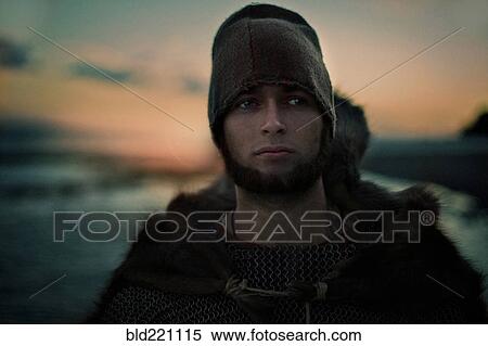 Stock Photography - Caucasian man wearing hat and cape. Fotosearch