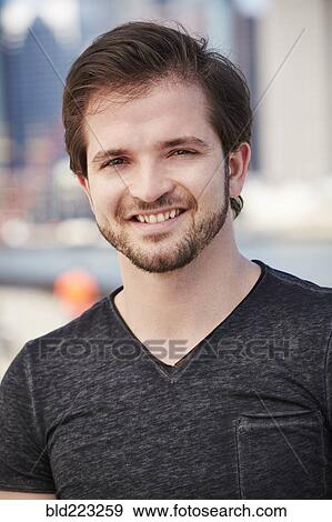 Stock Photo - Caucasian man with beard smiling. Fotosearch