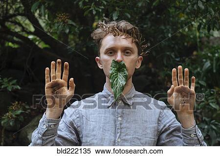 Caucasian man with dirty hands and leaf View Large Photo Image Stock Photography - Caucasian man with dirty hands and leaf. Fotosearch