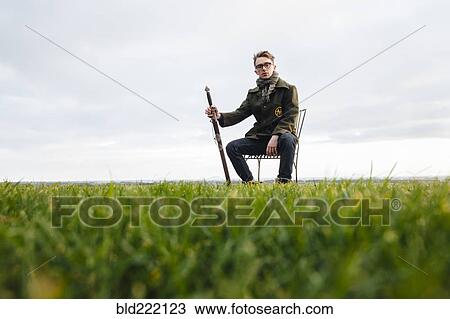 Caucasian man with sword in field View Large Photo Image Stock Image - Caucasian man with sword in field. Fotosearch