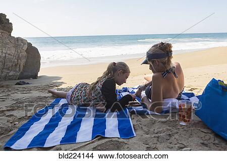 Caucasian mother and daughter playing backgammon on beach View Large Photo Image Picture - Caucasian mother and daughter playing backgammon on beach. Fotosearch