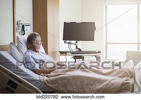 Caucasian patient sitting in hospital bed View Large Photo Image Stock Image - Caucasian patient sitting in hospital bed. Fotosearch
