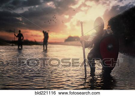 Caucasian soldiers standing in river View Large Photo Image Stock Photograph - Caucasian soldiers standing in river. Fotosearch