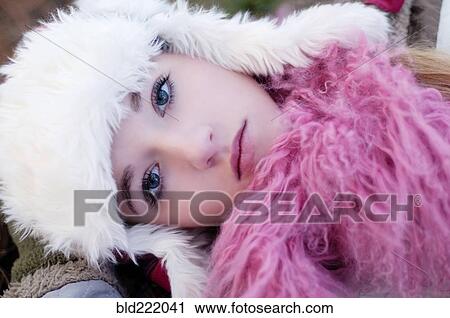 Stock Image - Caucasian teenage girl wearing fuzzy hat. Fotosearch