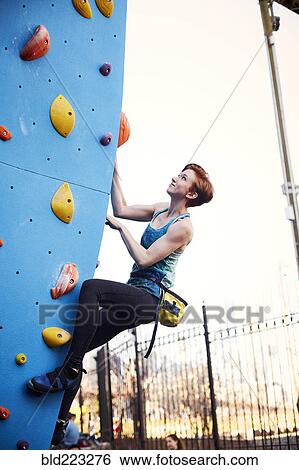 Caucasian woman climbing outdoor climbing wall View Large Photo Image Stock Photograph - Caucasian woman climbing outdoor climbing wall. Fotosearch