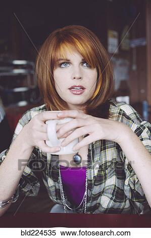 Caucasian woman drinking coffee in cafe View Large Photo Image Stock Photography - Caucasian woman drinking coffee in cafe. Fotosearch
