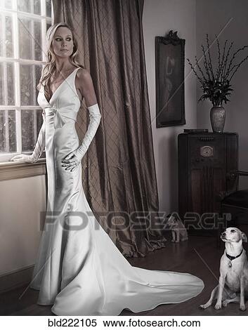 Caucasian woman in evening gown with dog View Large Photo Image Stock Photography - Caucasian woman in evening gown with dog. Fotosearch