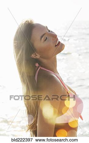 Caucasian woman in pink bikini at beach View Large Photo Image Stock Photo - Caucasian woman in pink bikini at beach. Fotosearch
