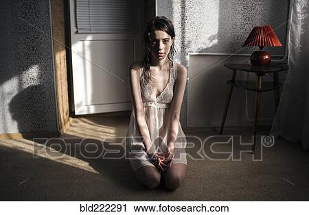 Caucasian woman kneeling on floor View Large Photo Image Stock Image - Caucasian woman kneeling on floor. Fotosearch