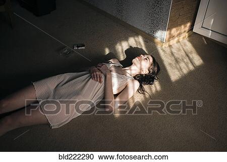 Caucasian woman laying in sun spot on floor View Large Photo Image Stock Image - Caucasian woman laying in sun spot on floor. Fotosearch