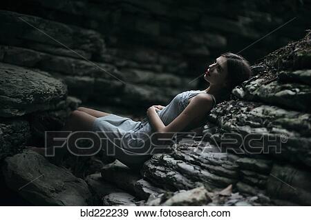 Caucasian woman laying on rock formation View Large Photo Image Stock Photo - Caucasian woman laying on rock formation. Fotosearch