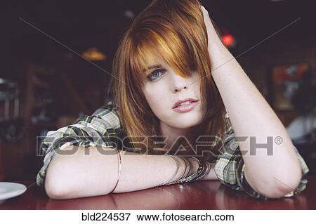 Caucasian woman leaning on table View Large Photo Image Stock Photo - Caucasian woman leaning on table. Fotosearch