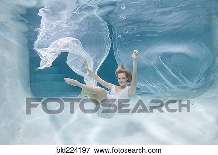 Caucasian woman posing in pool View Large Photo Image Stock Photo - Caucasian woman posing in pool. Fotosearch