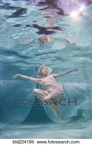 Stock Photography - Caucasian woman posing in pool. Fotosearch