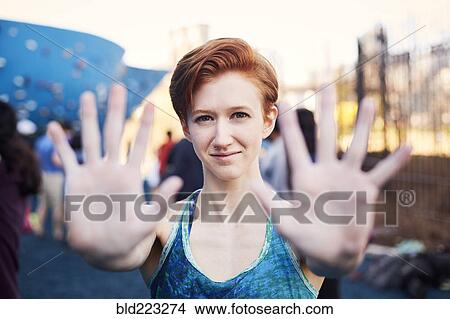 Picture - Caucasian woman showing palms of hands. Fotosearch