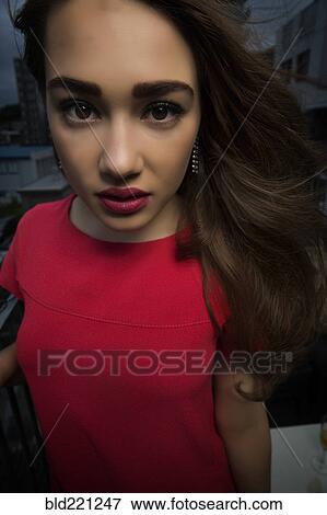 Stock Photo - Caucasian woman standing outdoors. Fotosearch