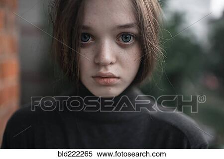 Stock Photography - Caucasian woman standing outdoors. Fotosearch