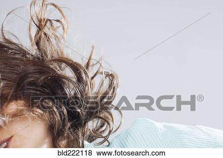 Stock Photo - Caucasian woman tossing her hair. Fotosearch