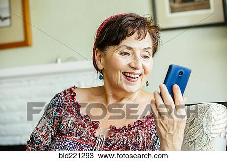 Caucasian woman using cell phone View Large Photo Image Stock Image - Caucasian woman using cell phone. Fotosearch