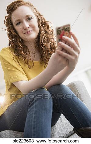 Caucasian woman using cell phone View Large Photo Image Stock Image - Caucasian woman using cell phone. Fotosearch