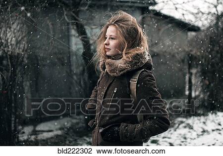 Caucasian woman walking in snow View Large Photo Image Stock Image - Caucasian woman walking in snow. Fotosearch