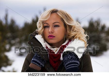 Caucasian woman wearing coat outdoors in winter View Large Photo Image Stock Photo - Caucasian woman wearing coat outdoors in winter. Fotosearch