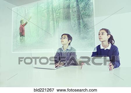 Children watching floating screen in online class View Large Photo Image Stock Photo - Children watching floating screen in online class. Fotosearch