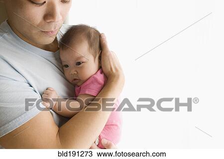 Chinese father holding baby daughter View Large Photo Image Stock Image - Chinese father holding baby daughter. Fotosearch