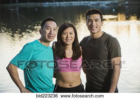 Stock Photograph - Chinese friends smiling in park. Fotosearch