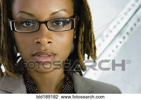 Close up of African businesswoman in eyeglasses View Large Photo Image Stock Image - Close up of African businesswoman in eyeglasses. Fotosearch