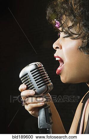 Stock Image - Close up of African female singer. Fotosearch