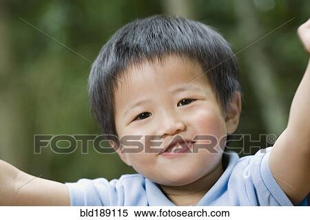 Stock Photography - Close up of Asian boy smiling. Fotosearch