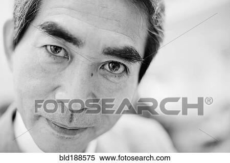 Stock Photography - Close up of Asian businessman. Fotosearch