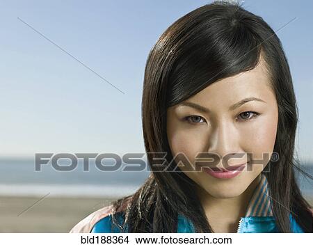 Picture - Close up of Asian woman smiling. Fotosearch