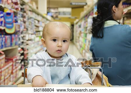 Close up of baby in shopping cart View Large Photo Image Picture - Close up of baby in shopping cart. Fotosearch