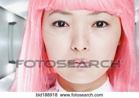 Close up of Chinese woman in pink wig View Large Photo Image Stock Photo - Close up of Chinese woman in pink wig. Fotosearch