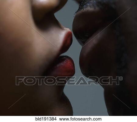 Picture - Close up of couple about to kiss. Fotosearch