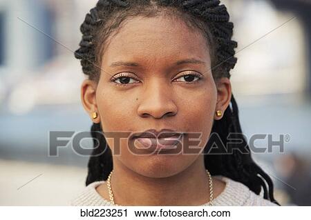 Stock Image - Close up of face of Black woman. Fotosearch