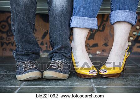 Close up of feet of sitting couple View Large Photo Image Stock Image - Close up of feet of sitting couple. Fotosearch