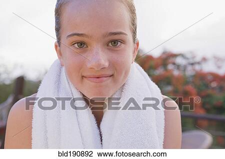 Stock Image - Close up of girl with towel around neck. Fotosearch